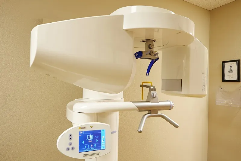 Modern dental X-ray machine with digital display in a clinic.